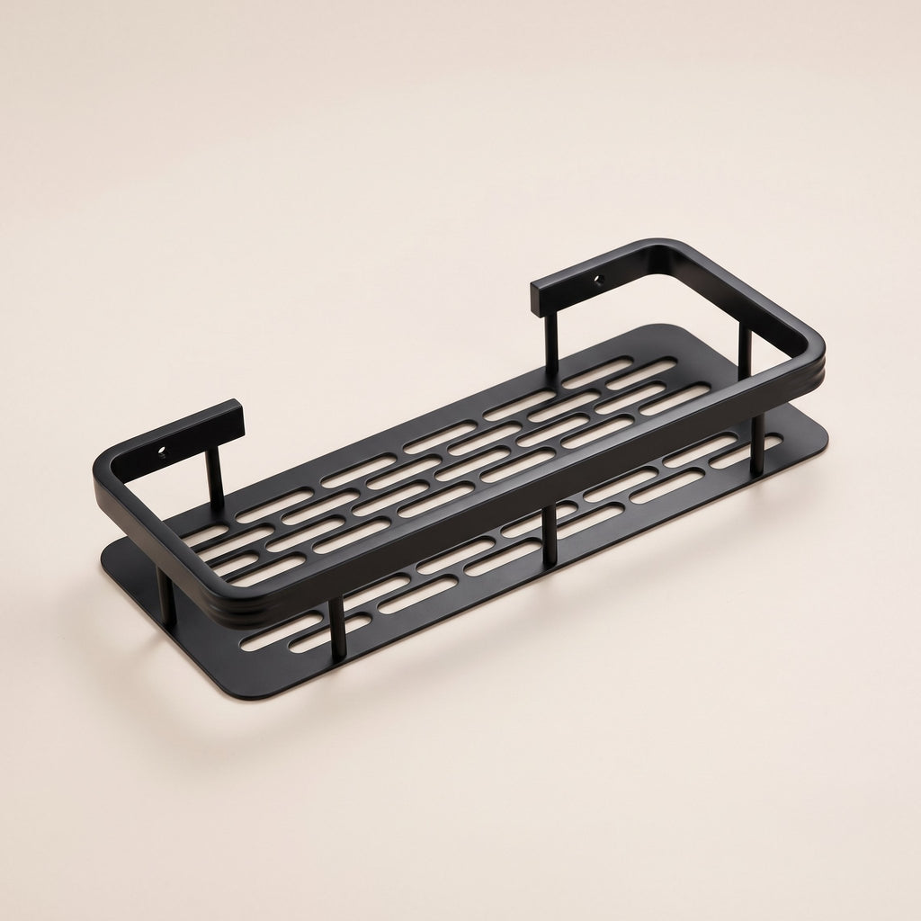 Repisa adhesiva para ducha de aluminio negro mate con base ranurada, sobre fondo blanco hueso.